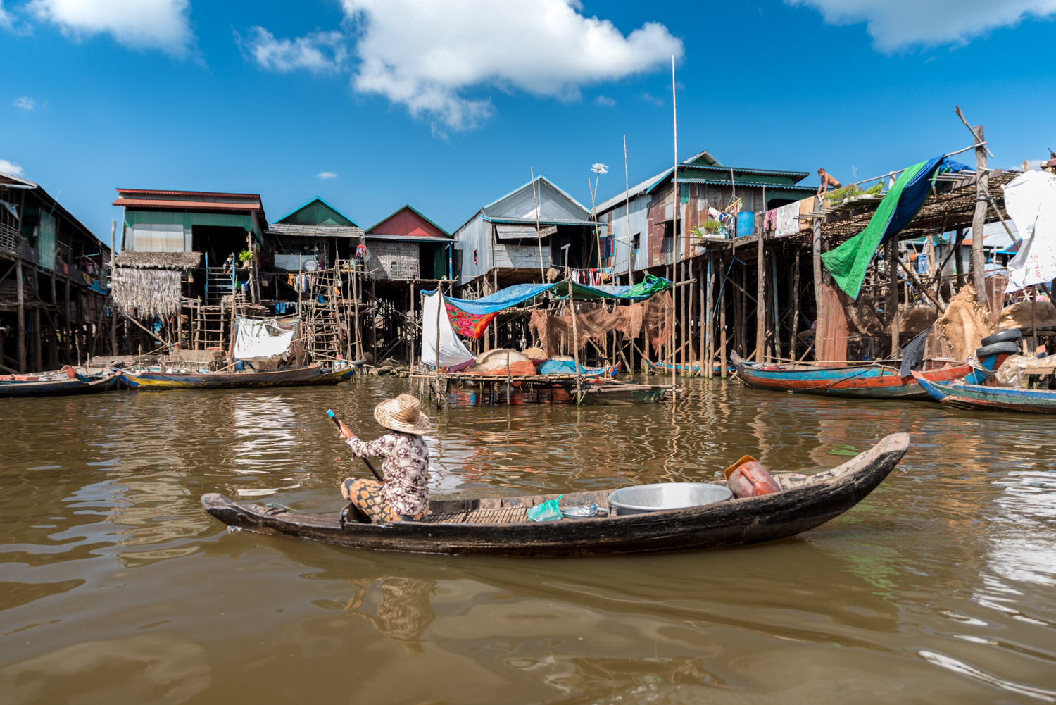 CAMBODIA FLOATING AND STILTED VILLAGES think orange