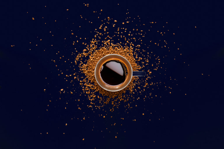 Coffee around the world - hot coffee in orange cup