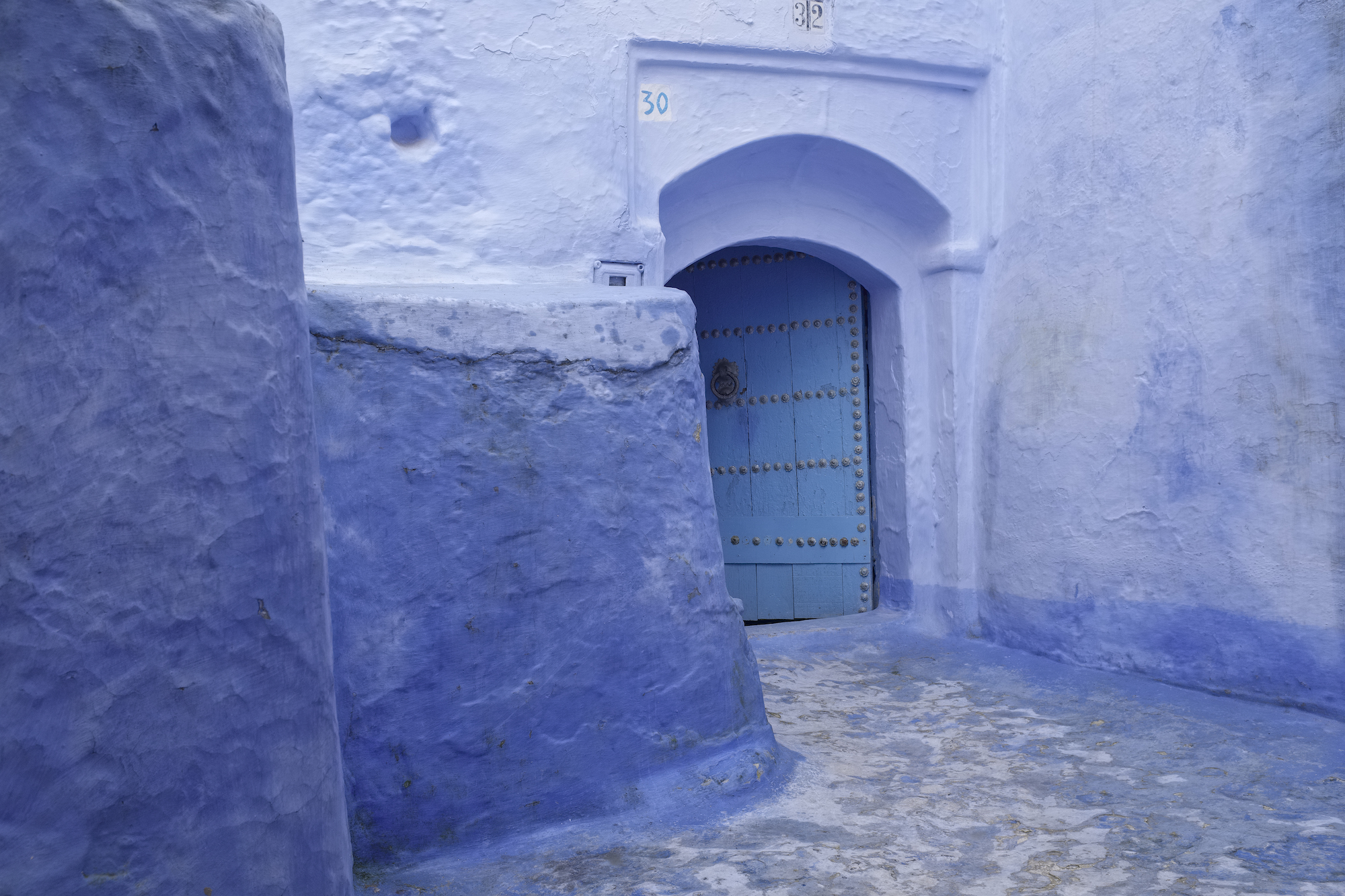 Photo of blue walls in Chefchaouen, Morocco, by Laurie Cohen.