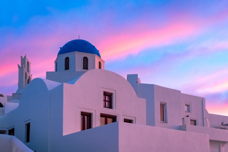 Photo of a pink sunset in Santorini, by Jane Jamison, on Think Orange Magazine.